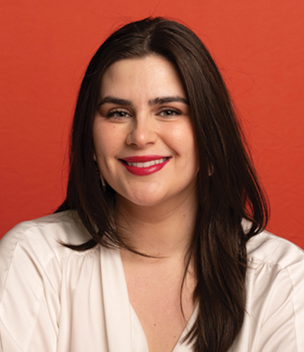 Portrait orientation photograph headshot of Sydney Copley smiling