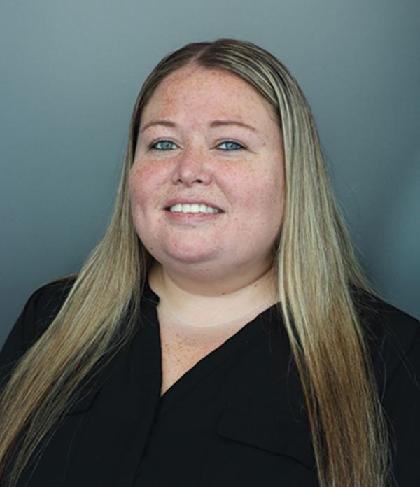 Portrait orientation photograph headshot of Tianna Carlson smiling