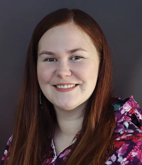Portrait orientation photograph close-up headshot view of Casey Sifsof smiling