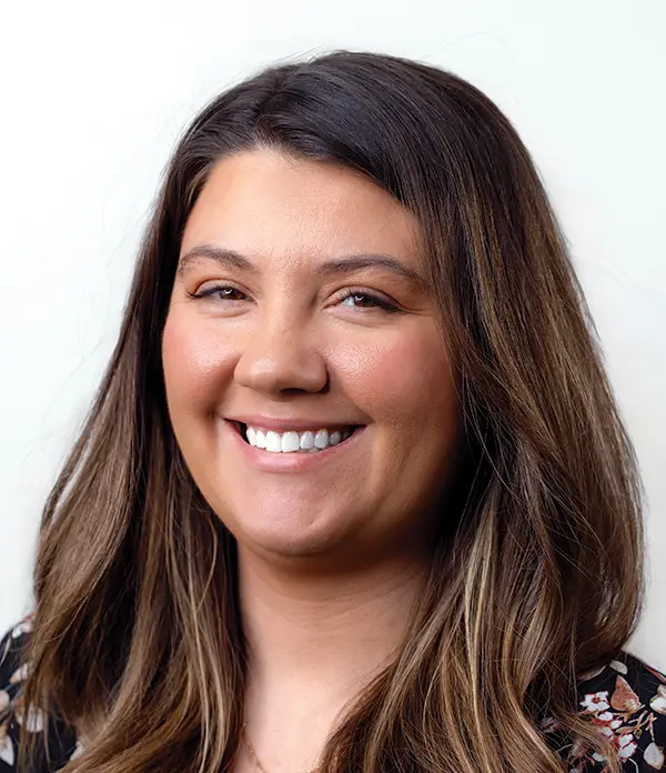 Portrait orientation photograph close-up headshot view of Chelsea Diggs smiling