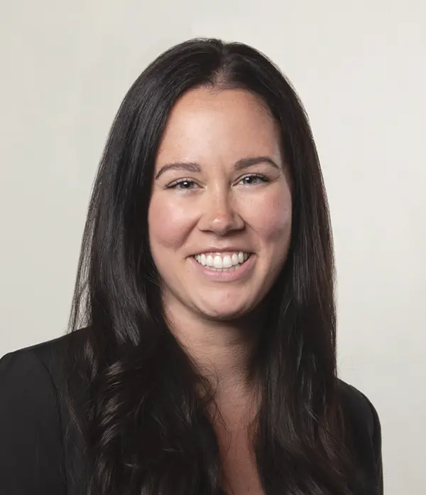 Portrait orientation photograph close-up headshot view of Kala Wilson smiling