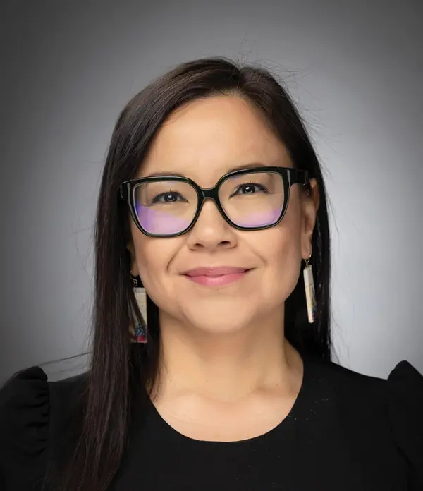 Portrait orientation photograph close-up headshot view of Polly Watson grinning