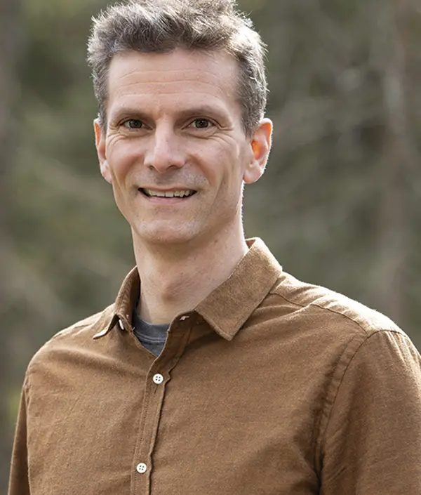 Portrait orientation photograph close-up headshot view of David Popiel smiling