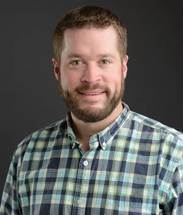Portrait orientation photograph close-up headshot view of Jeff Brace smiling