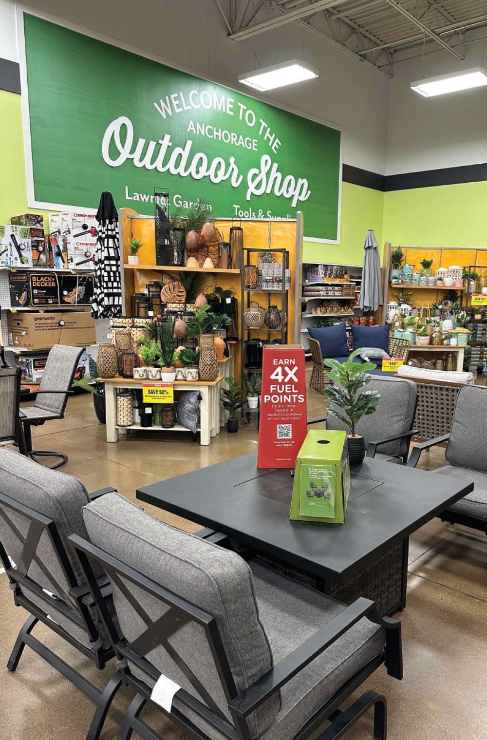 A front-facing, wide-angle interior shot of a store's outdoor living and garden section.