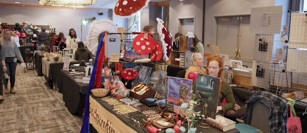 a table booth displaying the many crafts and items created and used by Alaska Enchanted Events