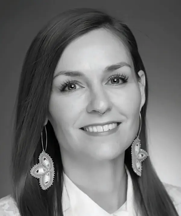 Portrait orientation photograph close-up headshot view of Julia Hnilicka smiling