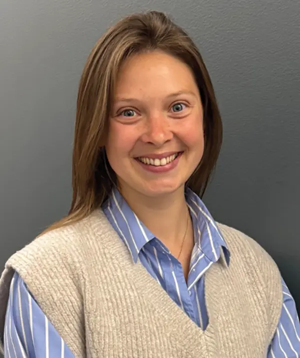 Portrait orientation photograph close-up headshot view of Lindsey Sutherland smiling