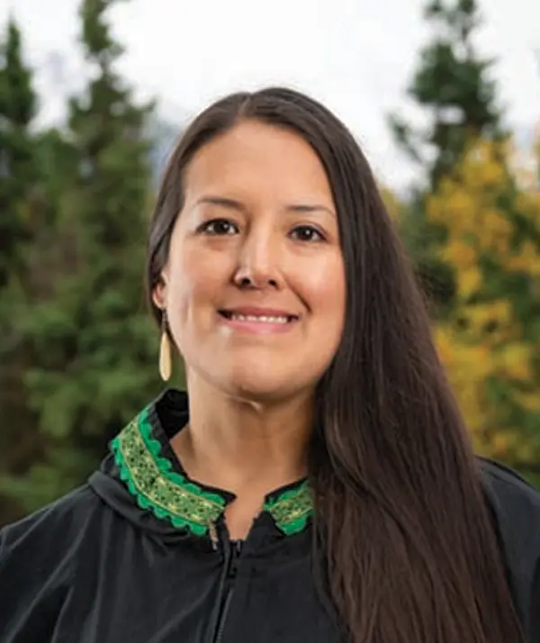 Portrait orientation photograph close-up headshot view of Dr. Michele Yatchmeneff smiling