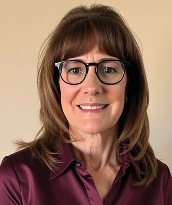 Portrait orientation photograph close-up headshot view of Natalie Travers-Smyre smiling