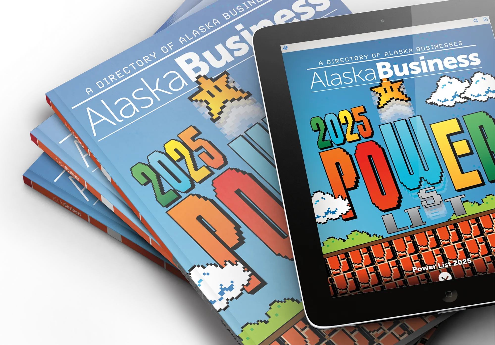 Alaska Business 2025 Power List issue shown in print and digital formats, with a retro video game–style cover design featuring pixelated clouds, blocks, and colorful text.