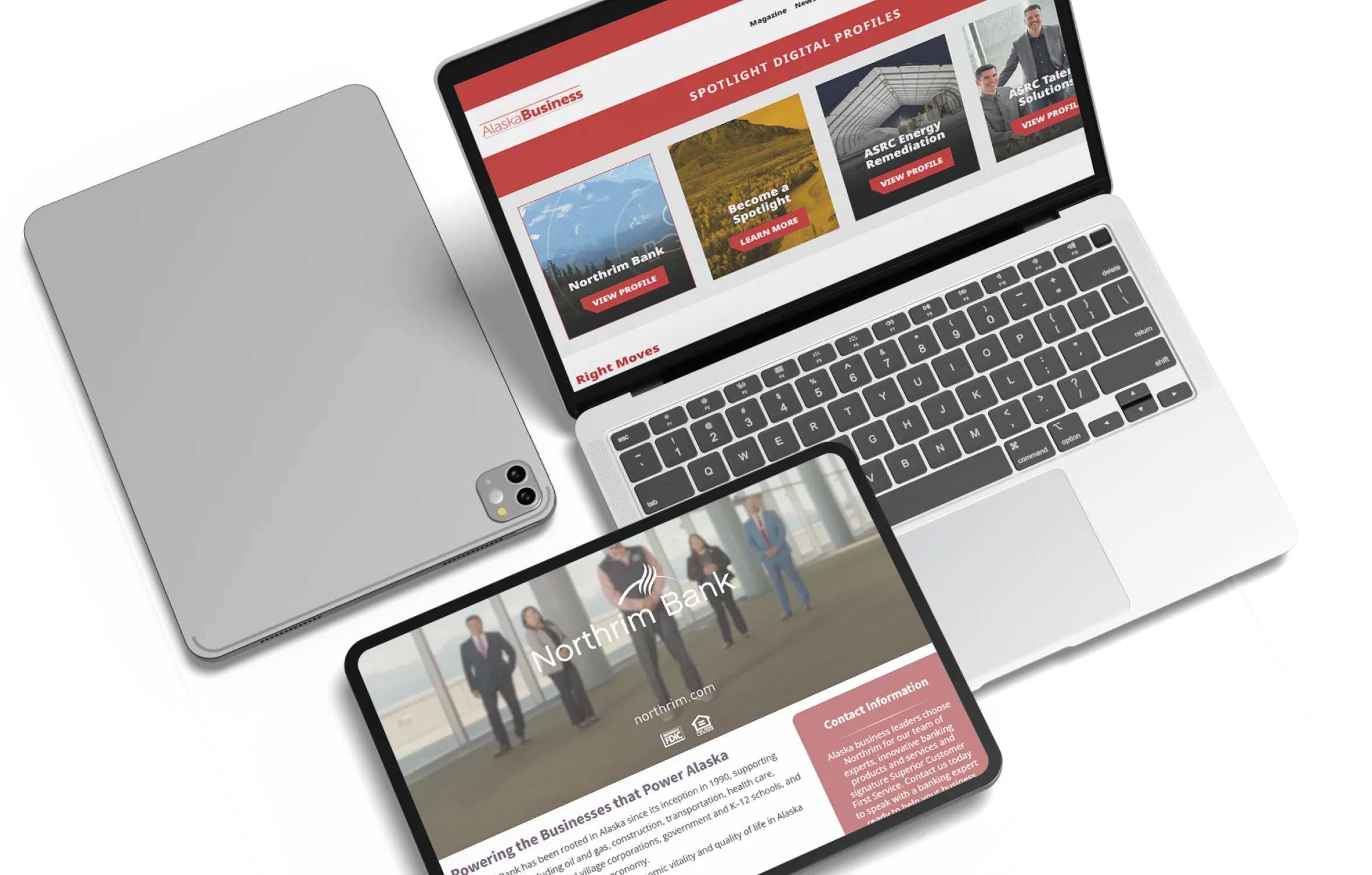 Laptop and tablet displaying Alaska Business Spotlight Digital Profiles, with company features including Northrim Bank and ASRC.