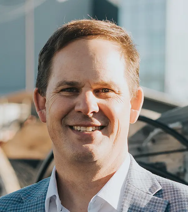 Portrait orientation photograph headshot close-up of Demian Voiles smiling