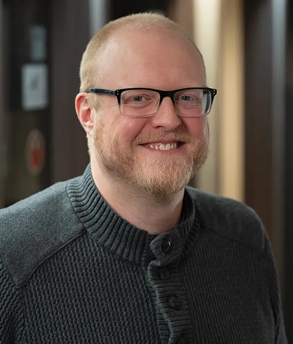 Headshot photograph of Toben Shelby smiling