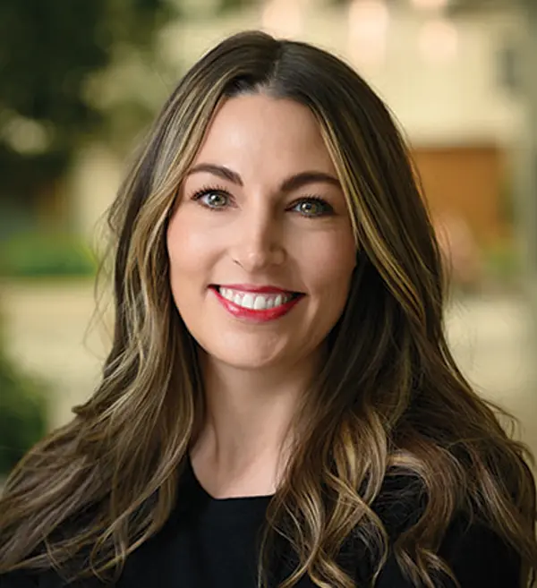 Headshot photograph of Dezi Robb smiling