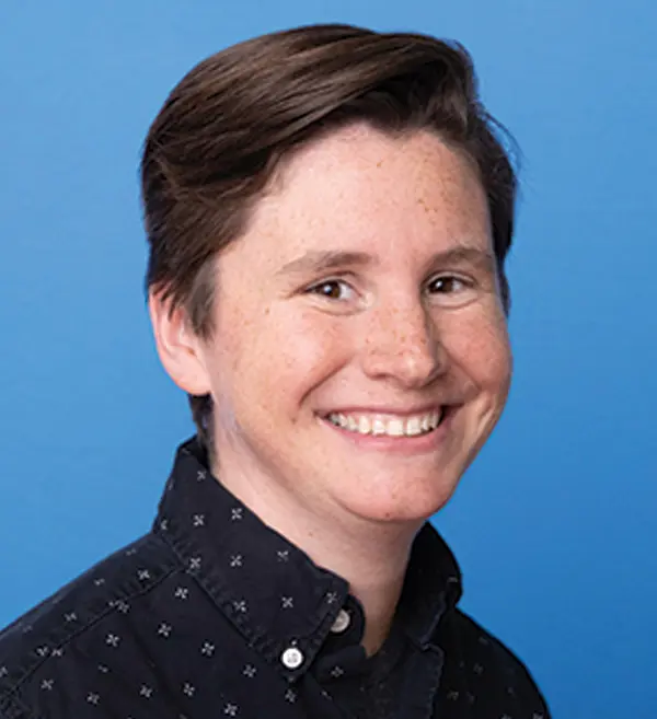 Headshot photograph of Issa Spatrisano smiling