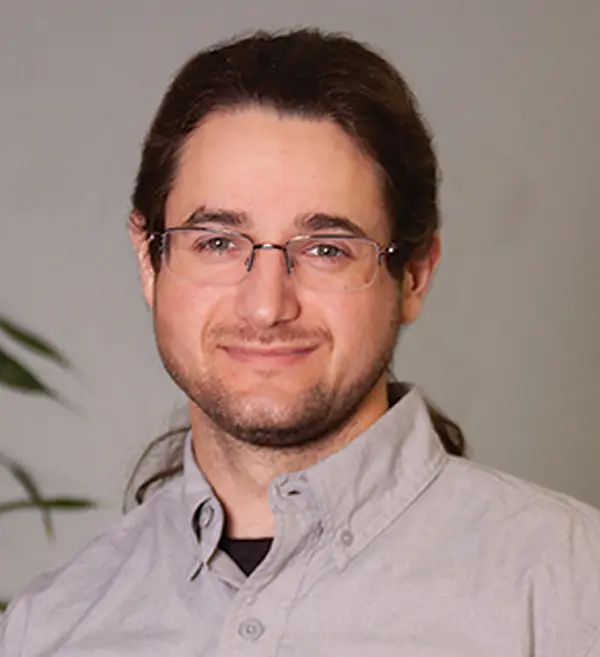 Headshot photograph of Jacob Ferrill grinning