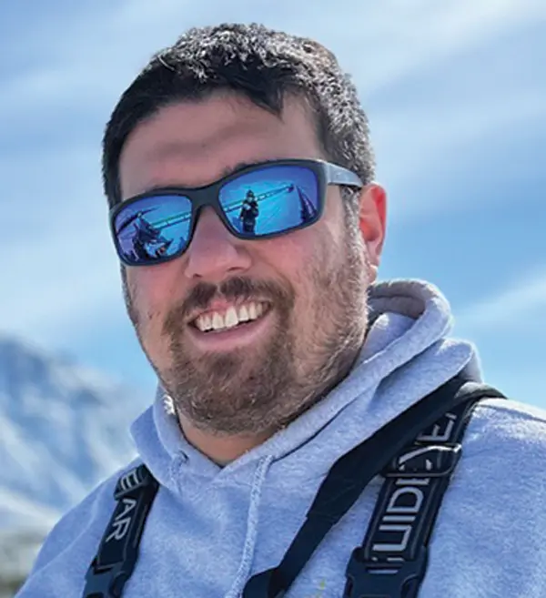 Headshot photograph of Josh Miranda smiling