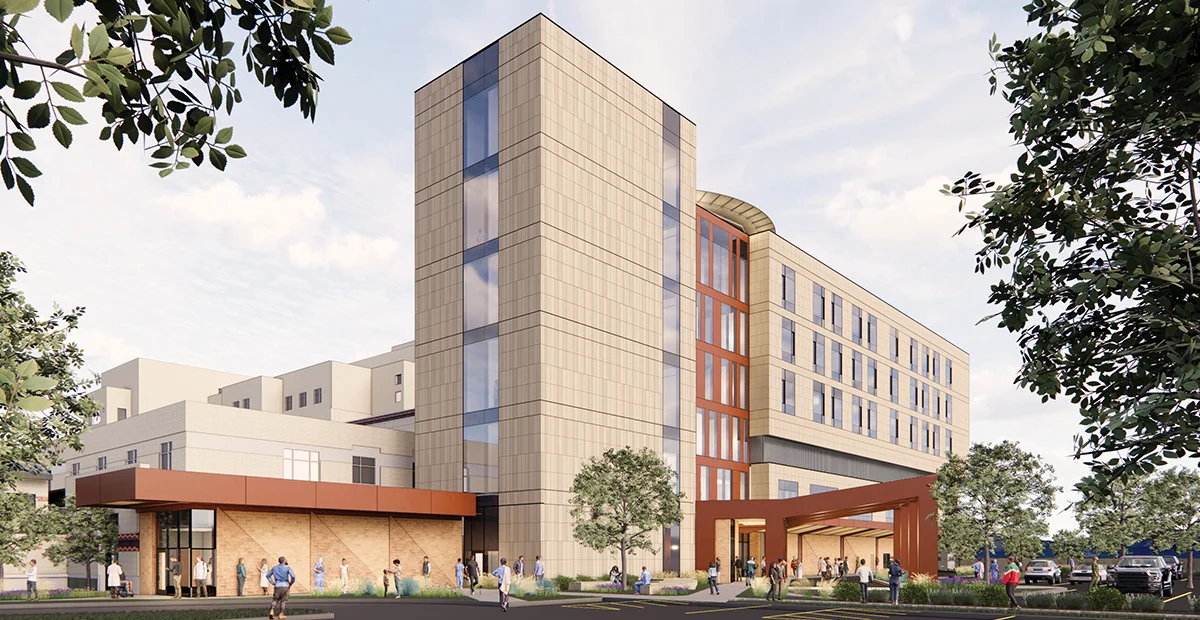 Architectural rendering of the Providence Alaska Medical Center expansion, featuring a modern multi-story tower with tan facade and integrated glass windows