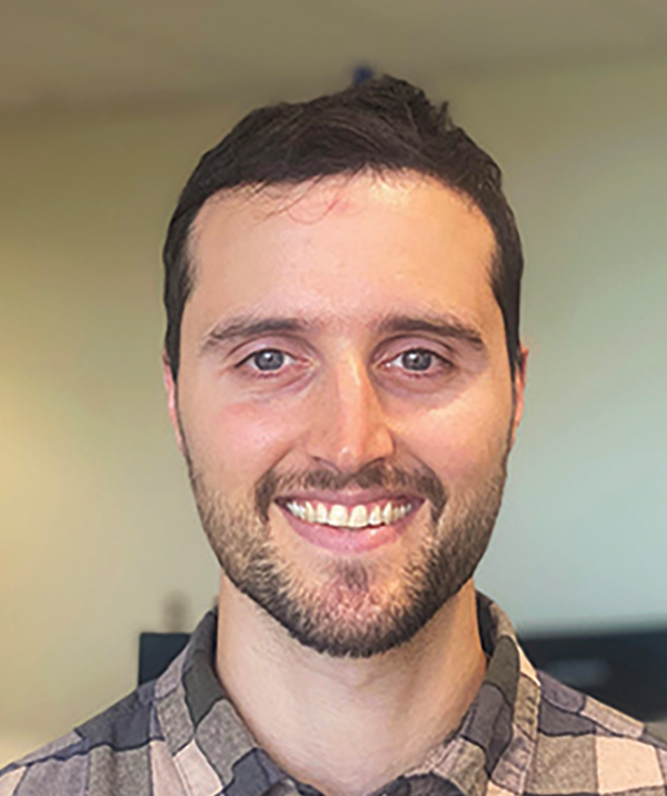 Headshot photograph of Noah Fowler smiling