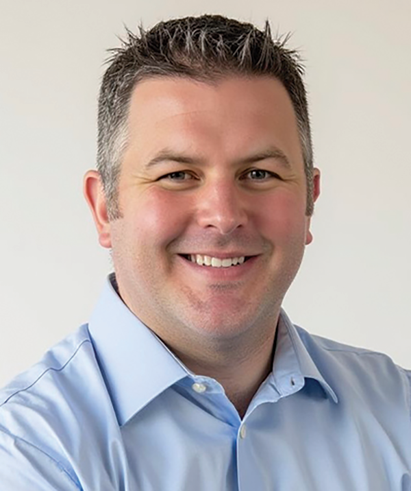 Headshot photograph of Steve Wackowski smiling