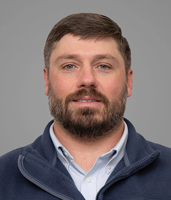 Headshot photograph of Beau Counts smiling