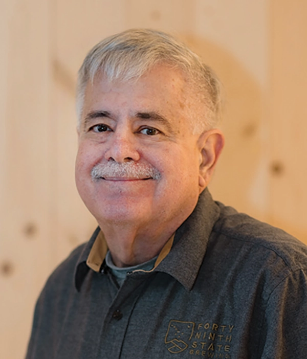 Headshot photograph of Jaime Jurado grinning