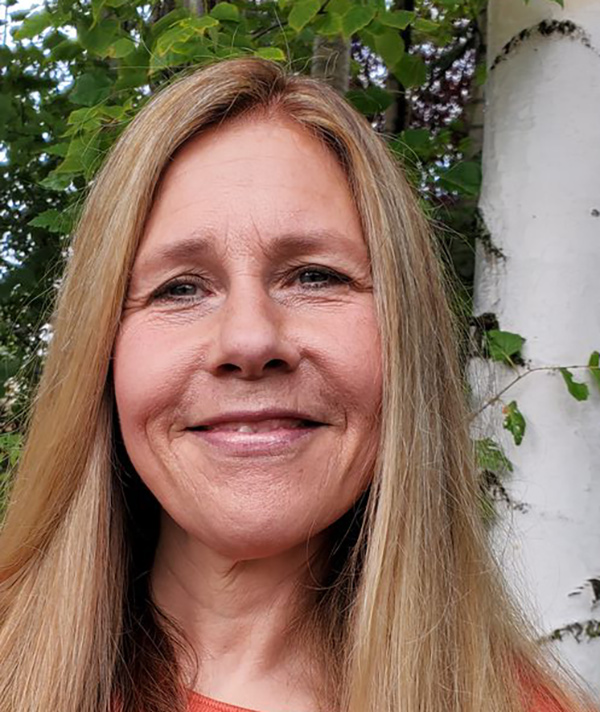 Headshot photograph of Gina Bastian smiling