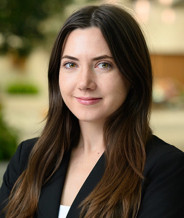 Headshot photograph of Kyla Lucey grinning