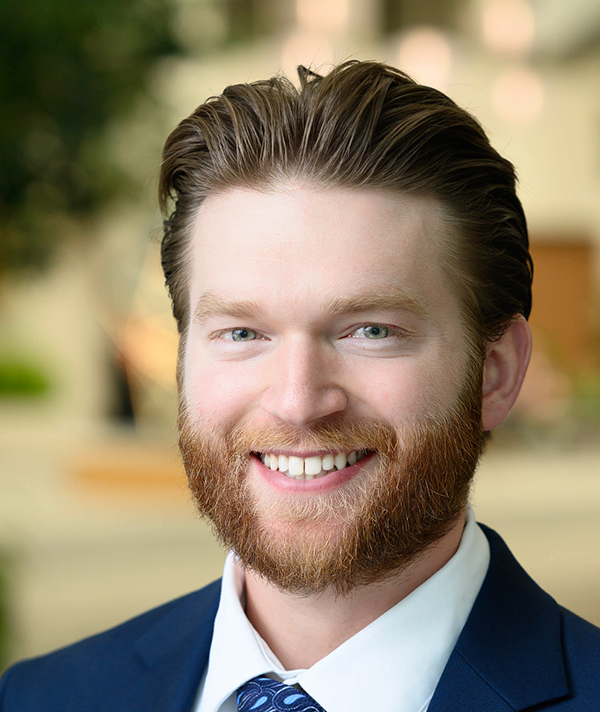 Headshot photograph of Michael Partrick smiling