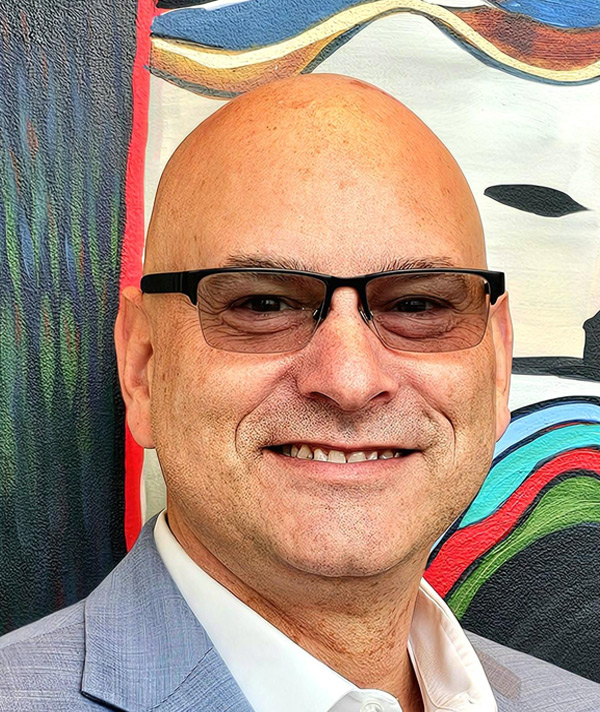 Headshot photograph of Patrick Faas smiling