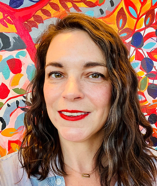 Headshot photograph of Susynn Snyder smiling