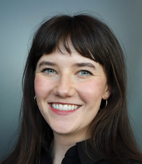 Headshot photograph of Ambriel Sandone smiling
