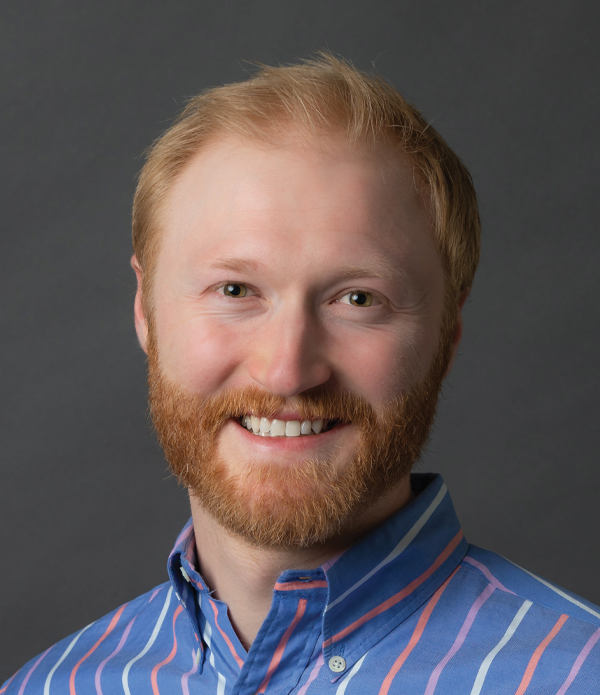 Headshot photograph of Bryant Wright smiling