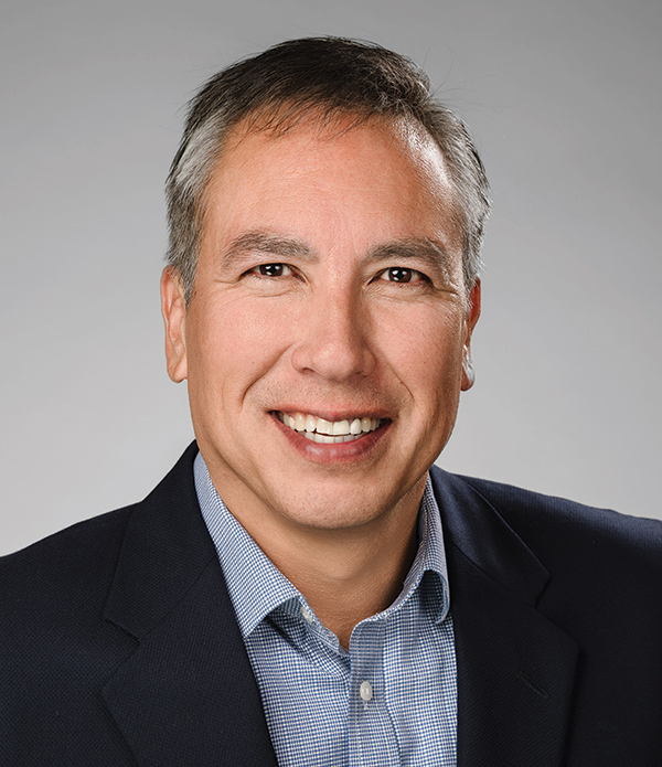Headshot photograph of Dan Winkelman smiling