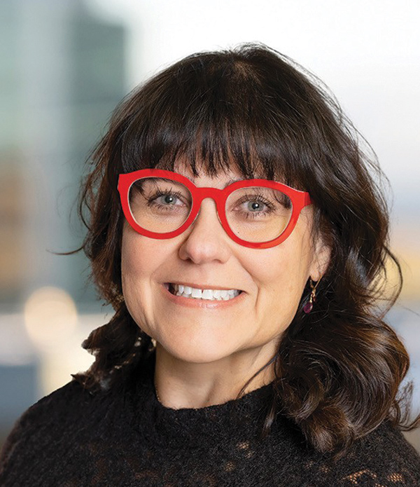 Headshot photograph of Kathleen Benoit smiling