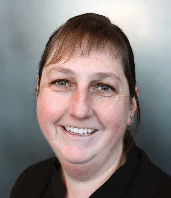 Headshot photograph of Molly Webb smiling