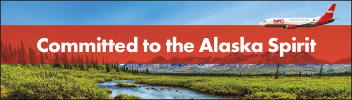 Northern Air Cargo advertisement showing an Alaska landscape beneath the message Committed to the Alaska Spirit.