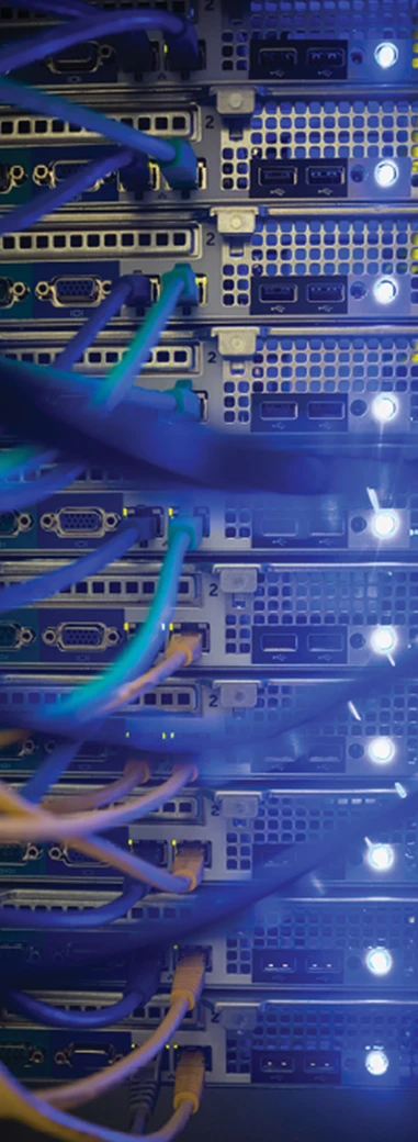 Network cables and equipment inside a data center represent industrial support services.