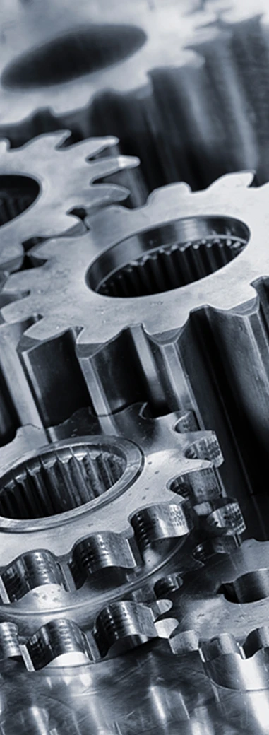 Close-up of metal gears representing engineering and technology.