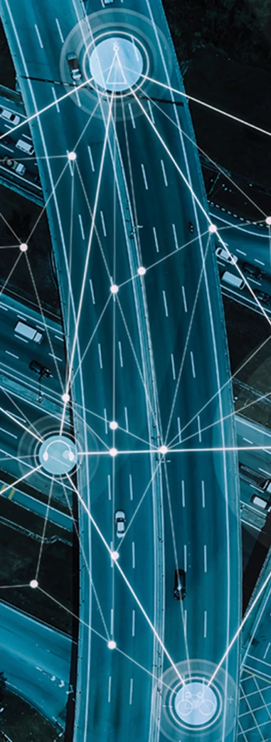 Abstract transportation corridor overlaid with connected digital network lines.