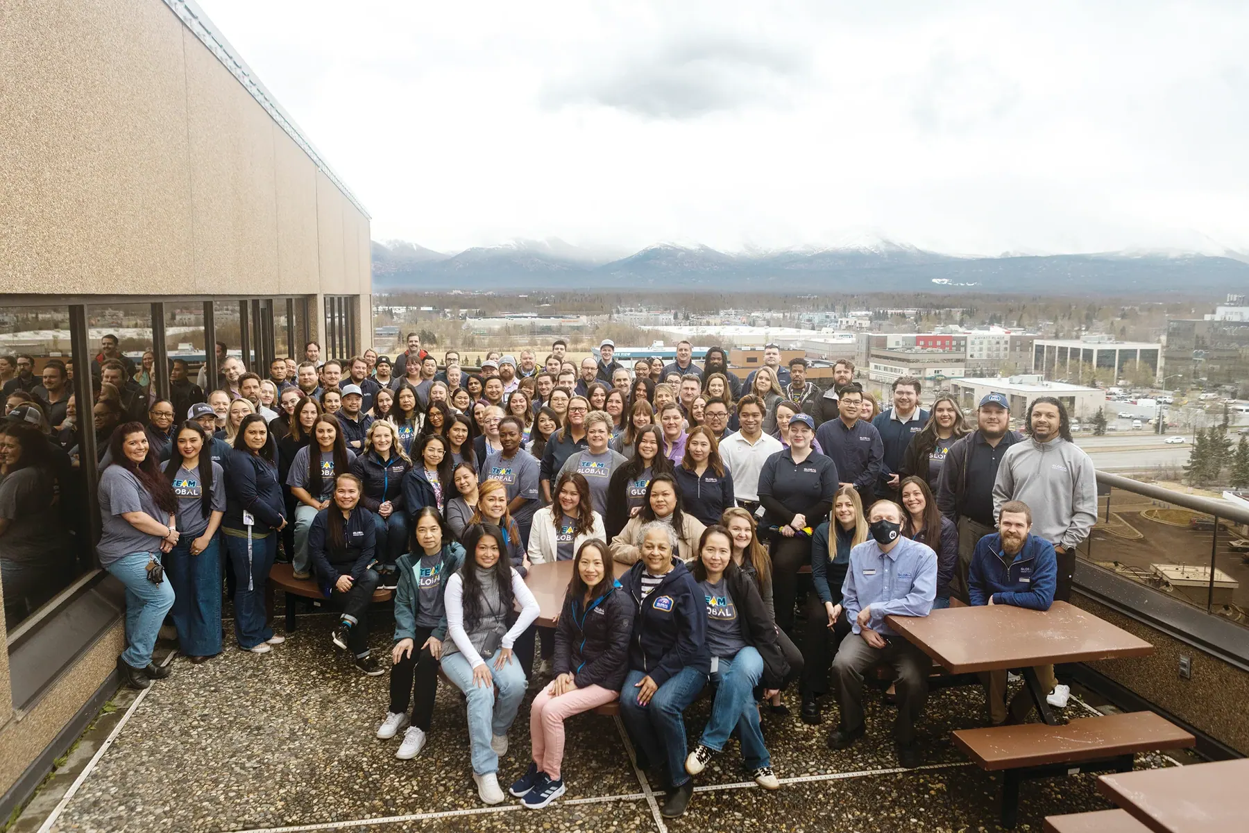 Global Credit Union employees gather on the outdoor terrace of the Global Credit Union C Street Headquarters in Anchorage.